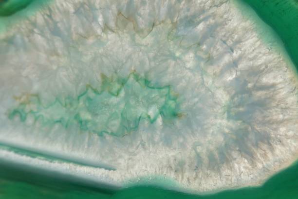 istock Green agate stone macro. Green agate slice texture.Natural stone bright Green background. Phone wallpaper 1143638806