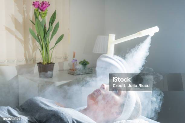 Beauty Treatment Of Face With Ozone Facial Steamer In Beauty Center Beaultiful Blonde Girl Stock Photo - Download Image Now