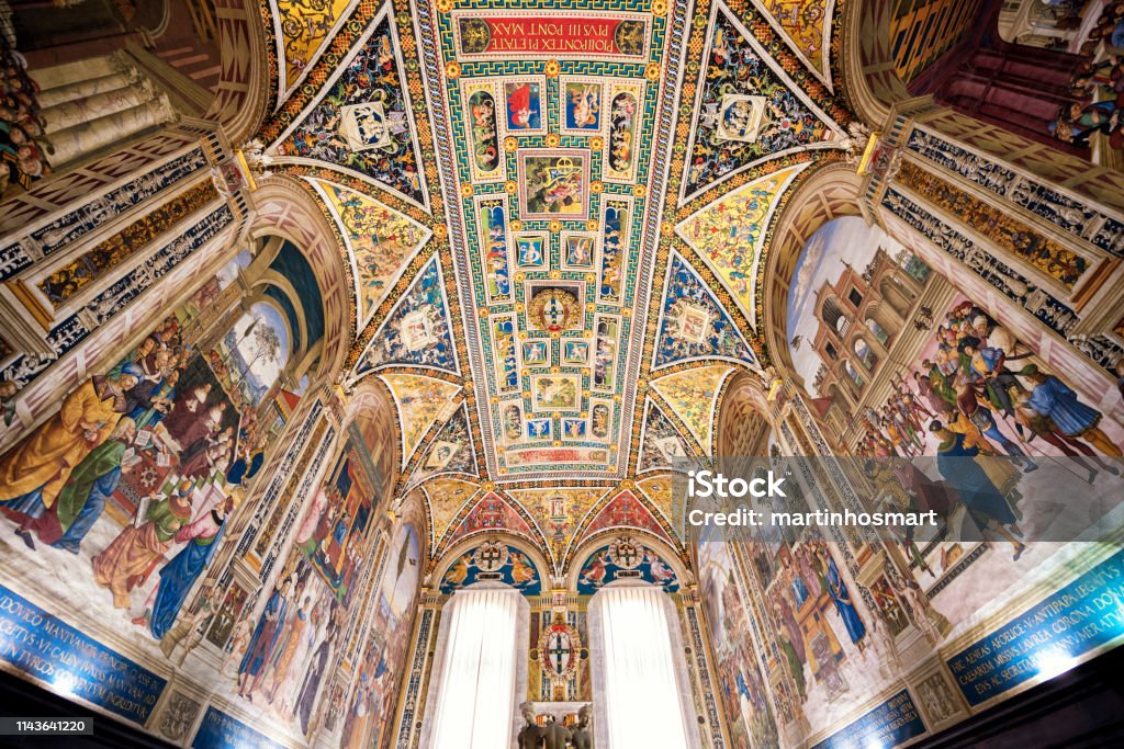 Fresco paint picture if Interior of Piccolomini Library in Siena Cathedral (Duomo di Siena) Siena, Italy - MAY 11, 2017: Fresco paint picture if Interior of Piccolomini Library in Siena Cathedral (Duomo di Siena) Ceiling Stock Photo