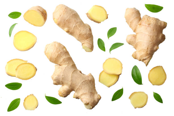 istock sliced ginger with leaves isolated on white background top view 1143645822