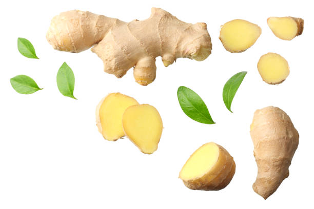 istock sliced ginger with leaves isolated on white background top view 1143645838