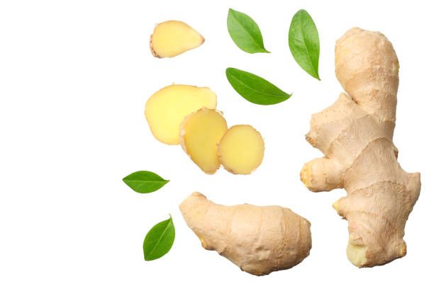 istock sliced ginger with leaves isolated on white background top view 1143645839