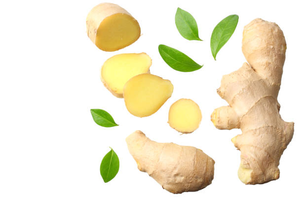istock sliced ginger with leaves isolated on white background top view 1143645858