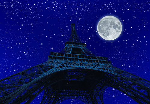 spooky full moon shining with dark Tour Eiffel at night with stars. Paris in France.