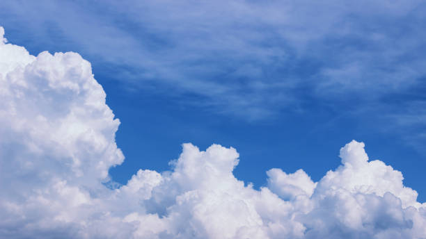 istock Blue sky with white clouds on a bright Sunny summer day. Natural background. 1143656881