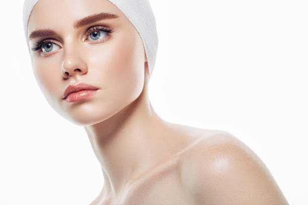 istock Applying skin cream on a woman's face 1143658954