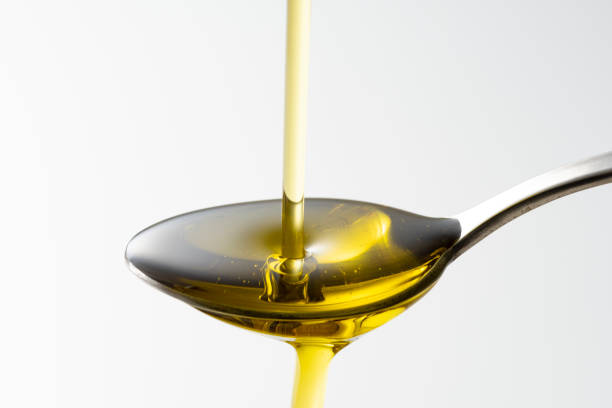 istock Scoop olive oil with a spoon 1143659144