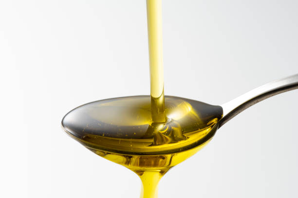 istock Scoop olive oil with a spoon 1143659152