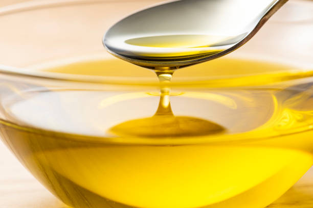 istock Scoop olive oil with a spoon 1143659160