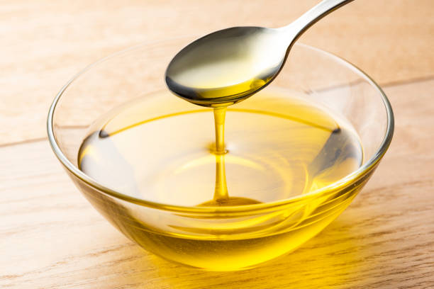 istock Scoop olive oil with a spoon 1143659174