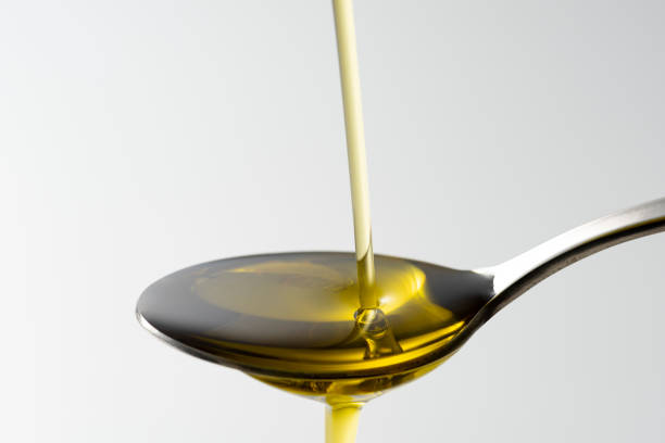 istock Scoop olive oil with a spoon 1143659239