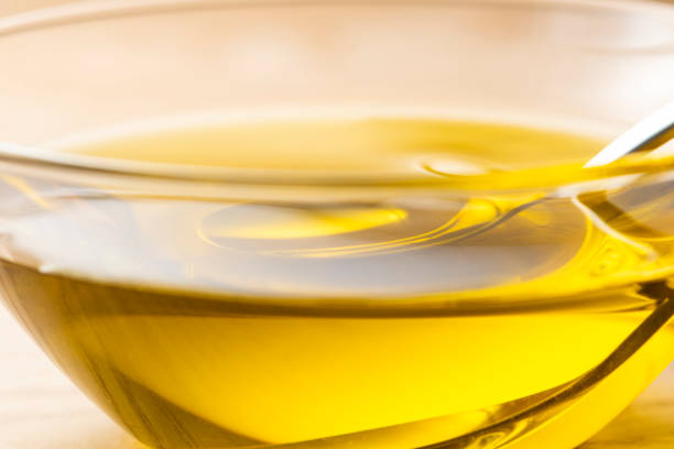 istock Scoop olive oil with a spoon 1143659694