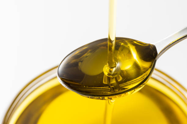 istock Scoop olive oil with a spoon 1143660292