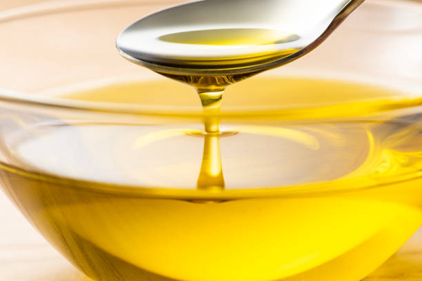 istock Scoop olive oil with a spoon 1143660339