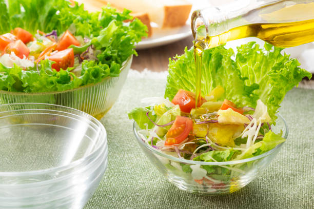 istock Apply olive oil to the salad 1143662107