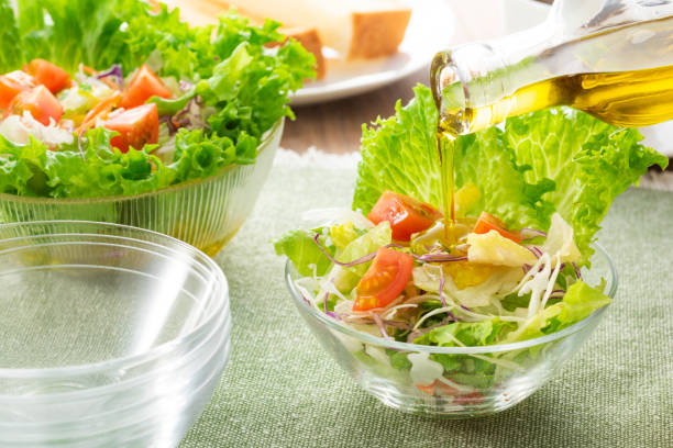 istock Apply olive oil to the salad 1143662125