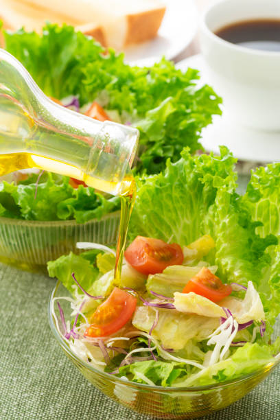 istock Apply olive oil to the salad 1143662134