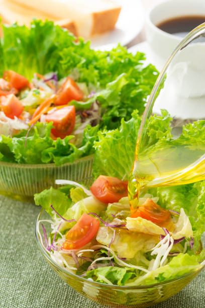 istock Apply olive oil to the salad 1143662144