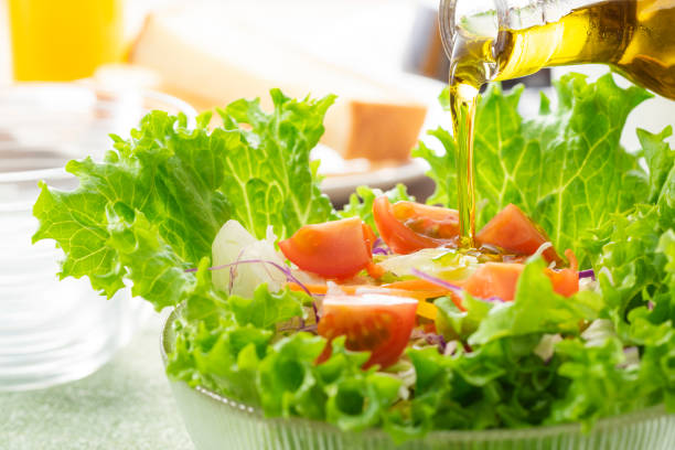 istock Apply olive oil to the salad 1143662170