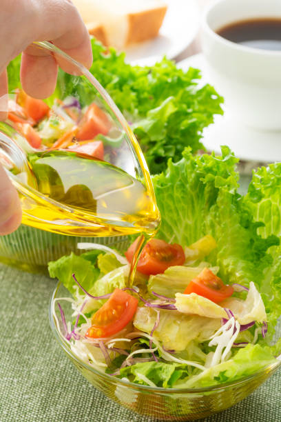 istock Apply olive oil to the salad 1143662200