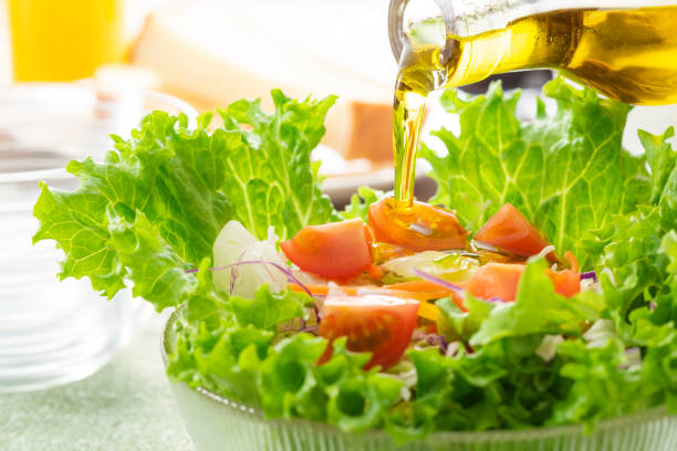 istock Apply olive oil to the salad 1143662214