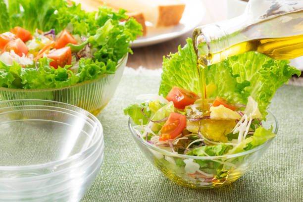 istock Apply olive oil to the salad 1143662230