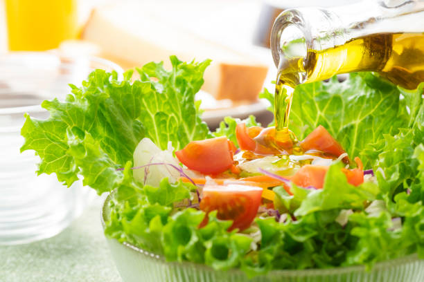 istock Apply olive oil to the salad 1143662243