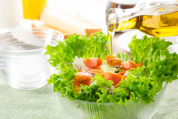 istock Apply olive oil to the salad 1143662291