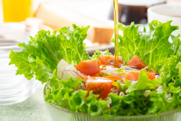 istock Apply olive oil to the salad 1143662307