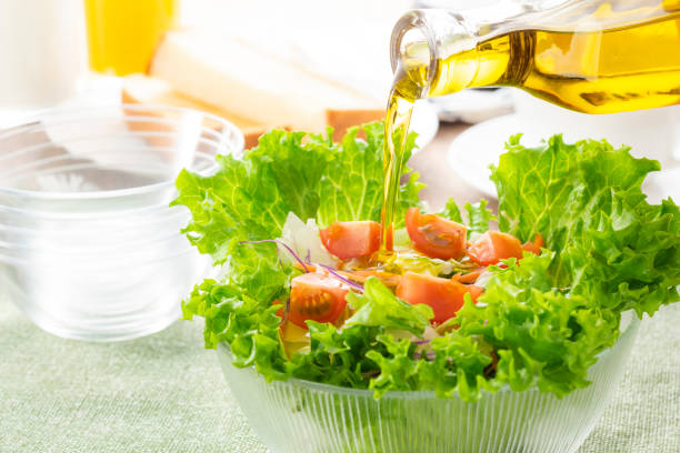 istock Apply olive oil to the salad 1143662345