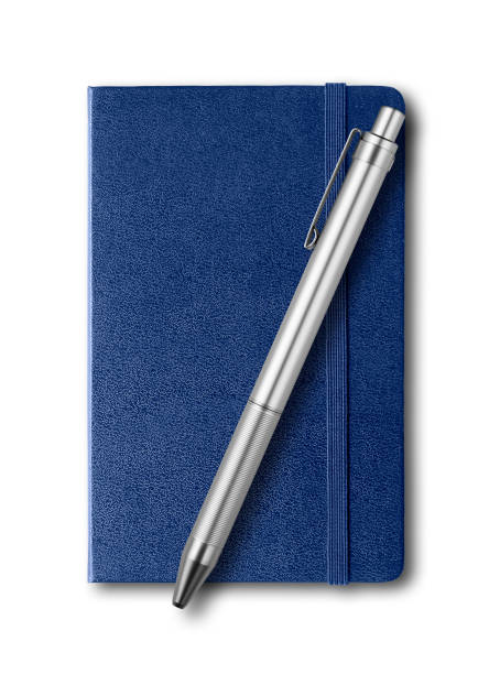 istock Marine blue closed notebook and pen isolated on white 1143662373