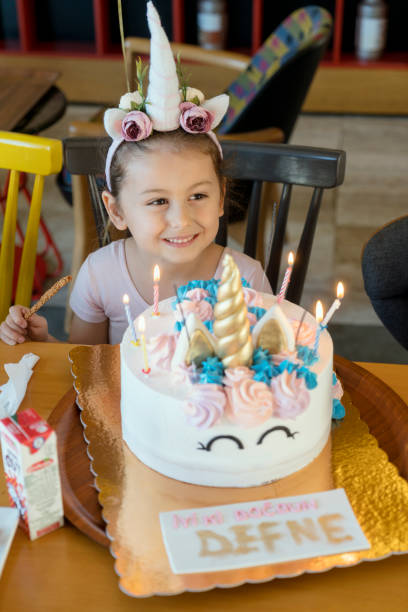 istock Cute little girl celebrating birthday 1143662409
