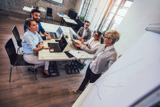istock Business colleagues in conference meeting room during presentation 1143663711