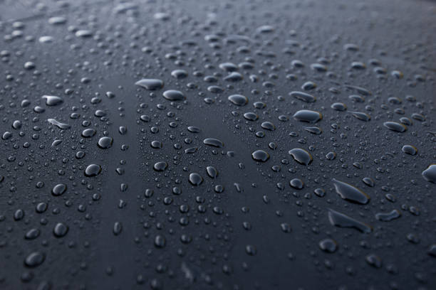 Water drops on a waterproof surface Water drops close up on a waterproof surface.ater-repellent material water repellent stock pictures, royalty-free photos & images