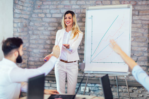 istock Business people working in office together. Team work in office. 1143671132