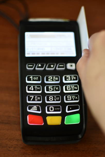 istock Hand holding credit card and paying on POS terminal 1143673115