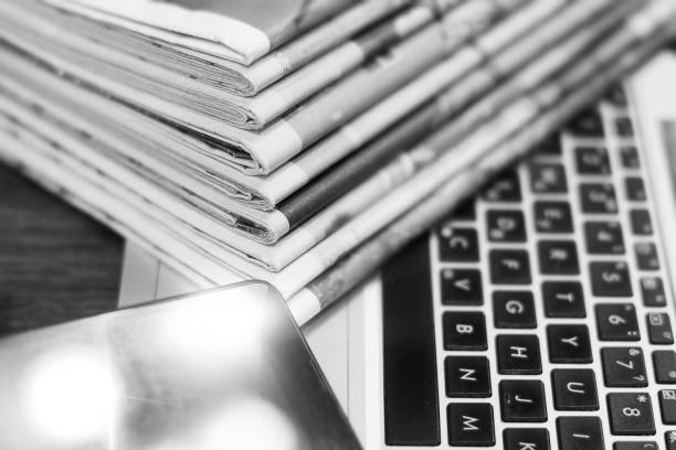 istock Newspapers, Laptop and Smart Phone 1143675363