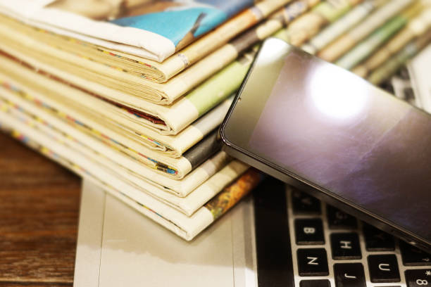 istock Newspapers, Laptop and Smart Phone 1143675410