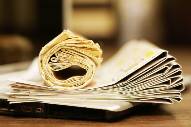 istock Newspapers and Laptop 1143675703