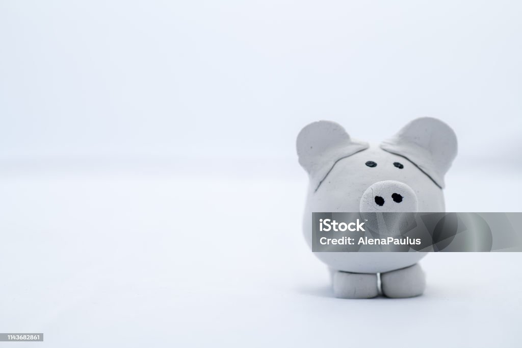Little imperfect childish white clay pig Little clay pig Clay Stock Photo