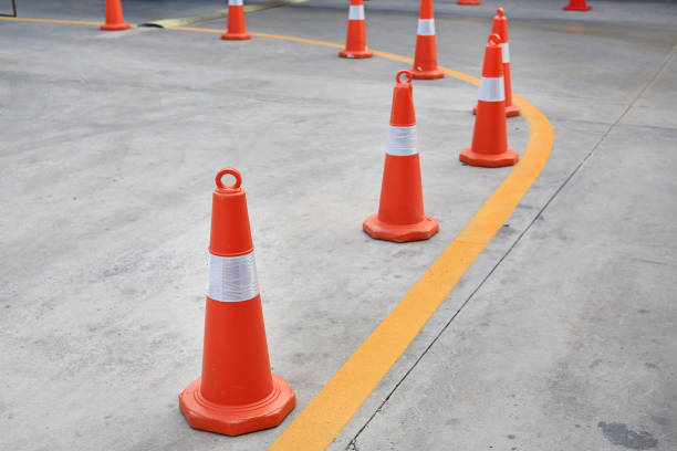 istock Row of orange rubber traffic cone placed in road. 1143683298