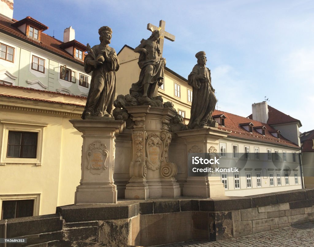 Sculptural group " Savior and Saints Kosma and Damian " on the Charles Bridge. Prague. Czech Architecture Stock Photo