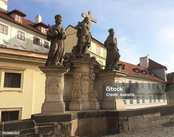 Sculptural Group Savior And Saints Kosma And Damian On The Charles Bridge Prague Czech Stock Photo - Download Image Now
