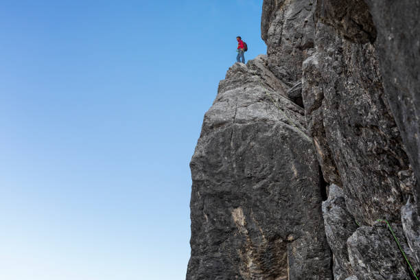 istock Bold - Alone Rock Climber is standing at rock ledge - Watzmann 1143684578