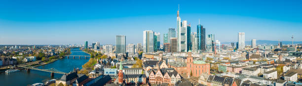 Frankfurt aerial panorama River Main Romer Altstadt skyscraper cityscape Germany Aerial panoramic vista across Frankfurt’s dynamic skyline, from the bridges across the River Main, the historic landmarks of the Old Town to the futuristic spires of the banking skyscrapers and the shops of Zeil and Hauptwache, Hesse, Germany. frankfurt skyline stock pictures, royalty-free photos & images