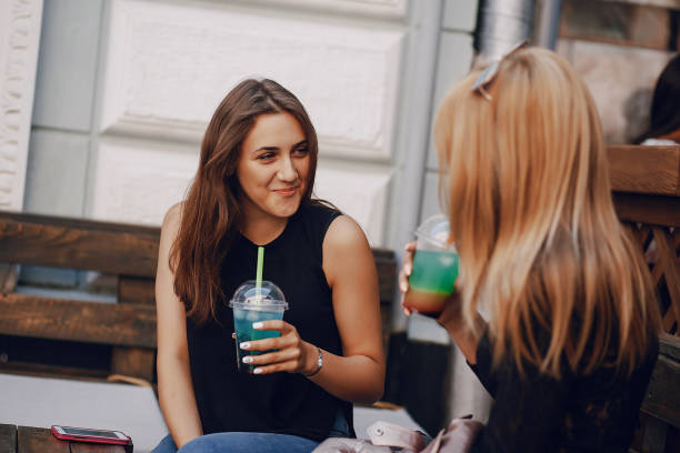 istock girls with cocktail 1143685432