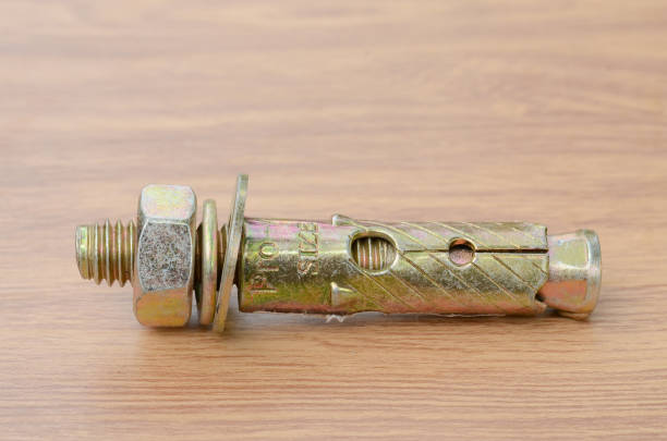 istock Tools and auto spare parts on a wooden work  bench surface. 1143685685