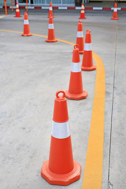 istock Row of orange rubber traffic cone placed in road. 1143685766