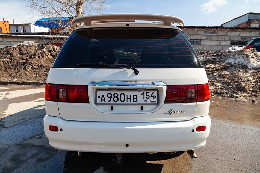 Novosibirsk, Russia - 04.10.2019: Rear view of Toyota Ipsum 1998 year in white color after cleaning before sale on parking