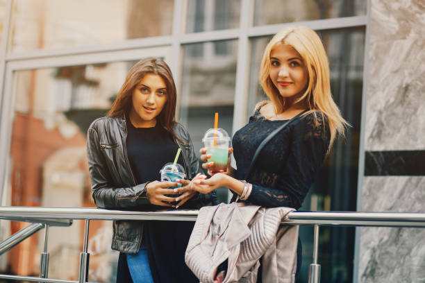istock girls with cocktail 1143688136
